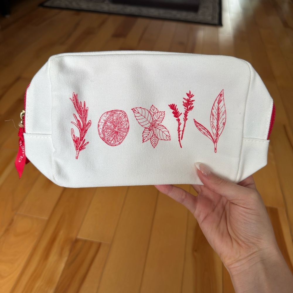 White Canvas Clarins Pouch with Red Botanical Design